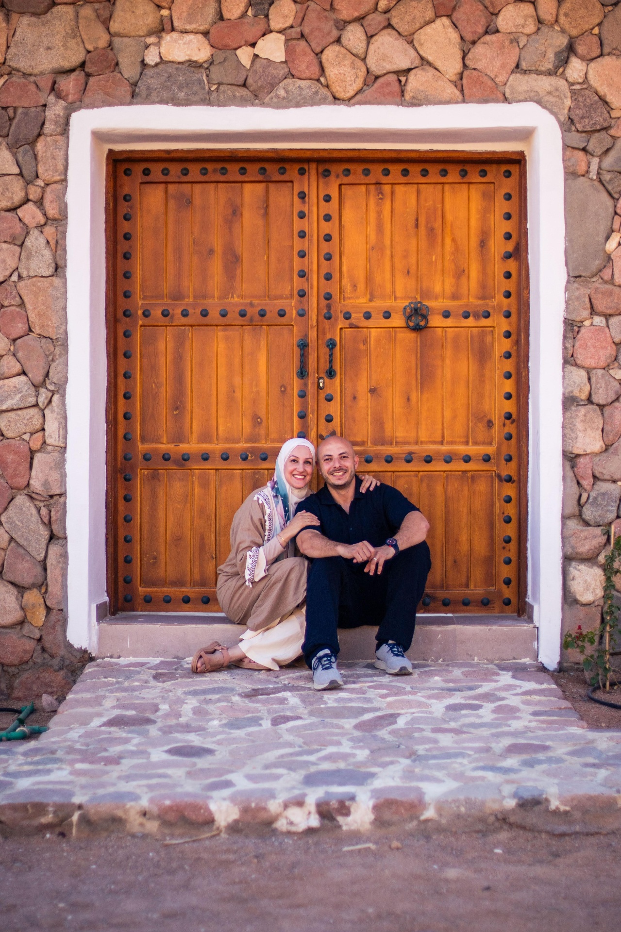Founders of Dar Katrine sitting together at their lodge entrance
