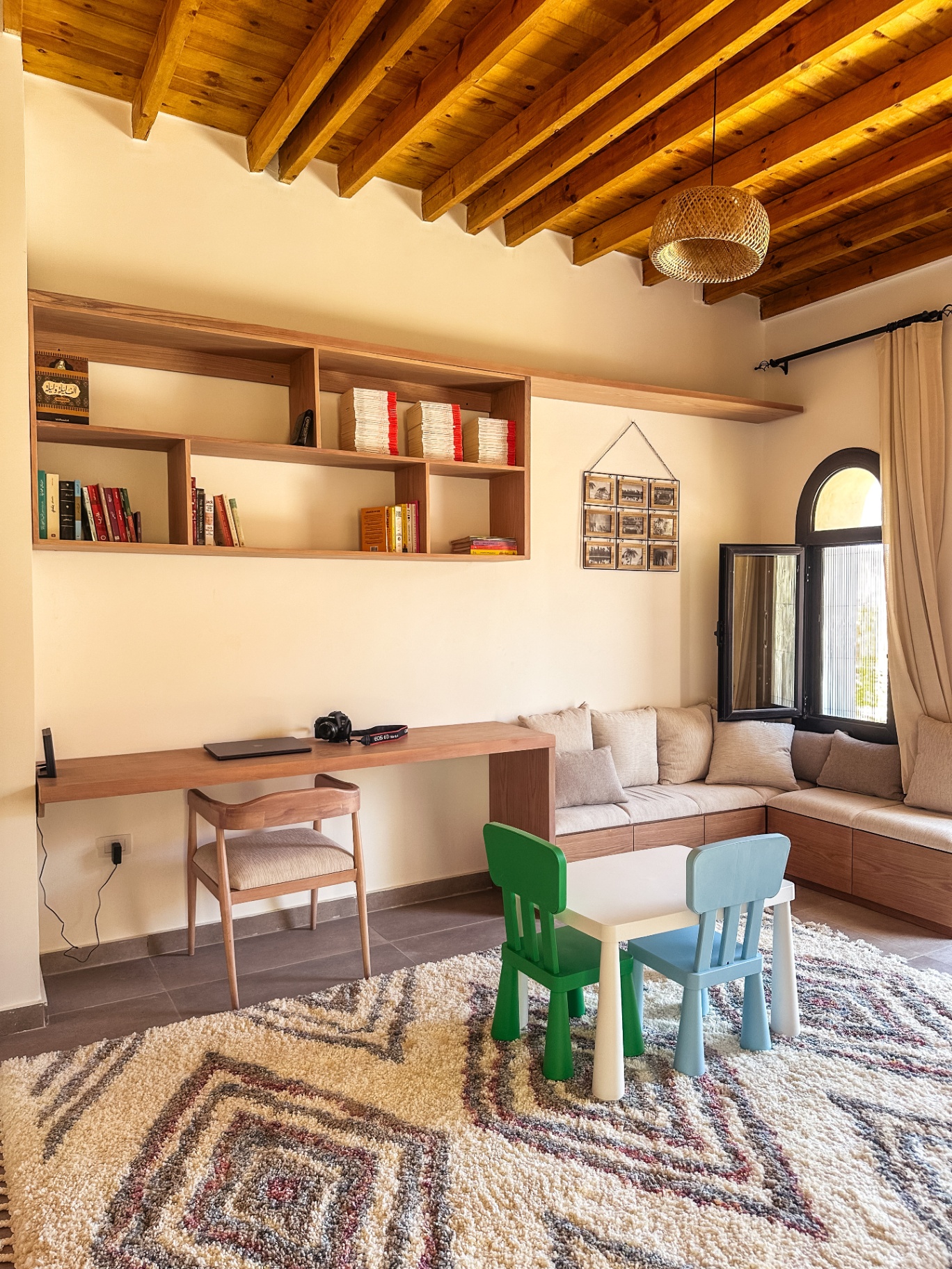 Study space with built-in desk, seating, and library
